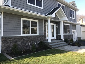 boulder creek faststak lasino cultured stone under window bluestone lip capping around door steps stoop walkway brick paver